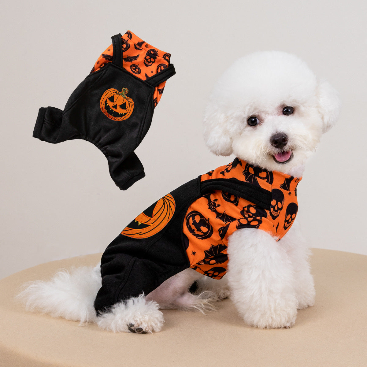 Halloween Party Creative dog costume in orange and black polyester with pumpkin and skull print and a sleeveless fit.