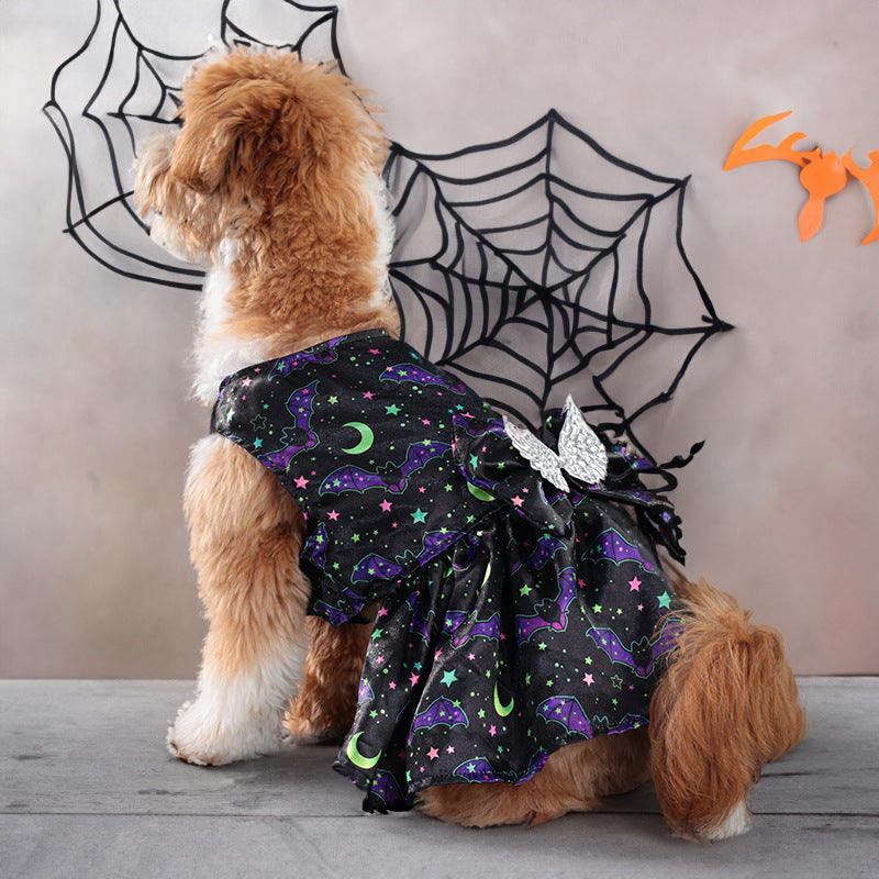 Angel Wings Pet Costume in black polyester, patterned with colorful bats, stars and moons, featuring silver wings and a flared skirt.