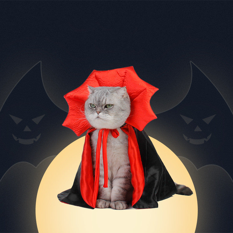 Halloween Pet Costume features a black satin-like pet cape with vivid red lining and a spiked red collar framing the head.