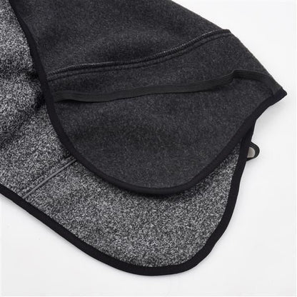 Water-repellent softshell dog jacket in gray, showcasing interior fabric for durability and comfort.