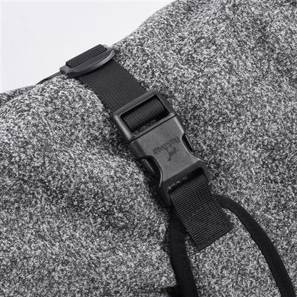 Water-repellent softshell dog jacket buckle detail.